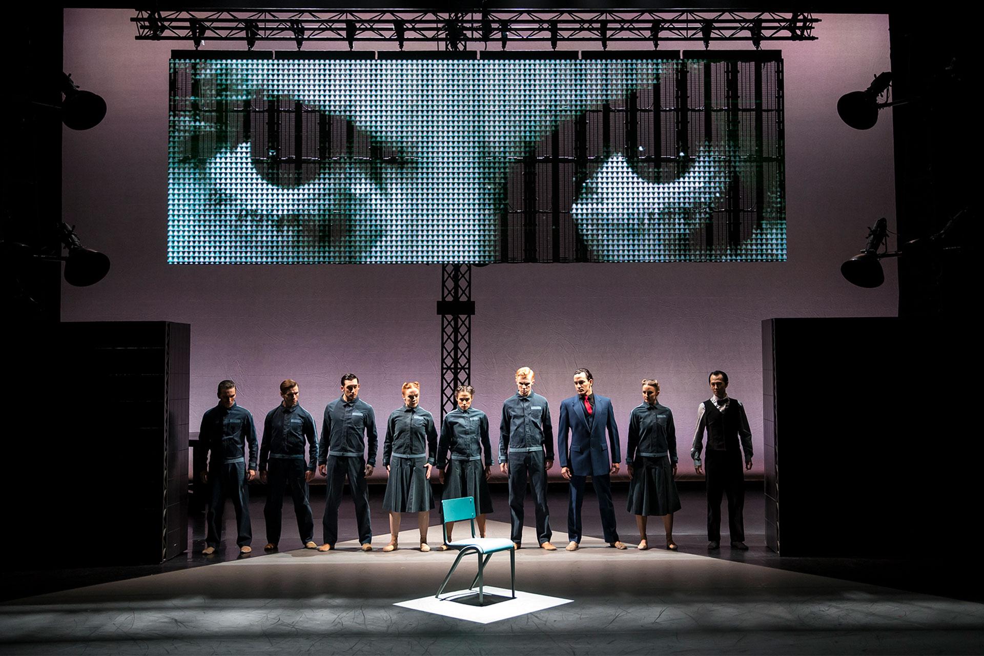 Members of the party look at the chair when the non-person, Winston Smith, never sat