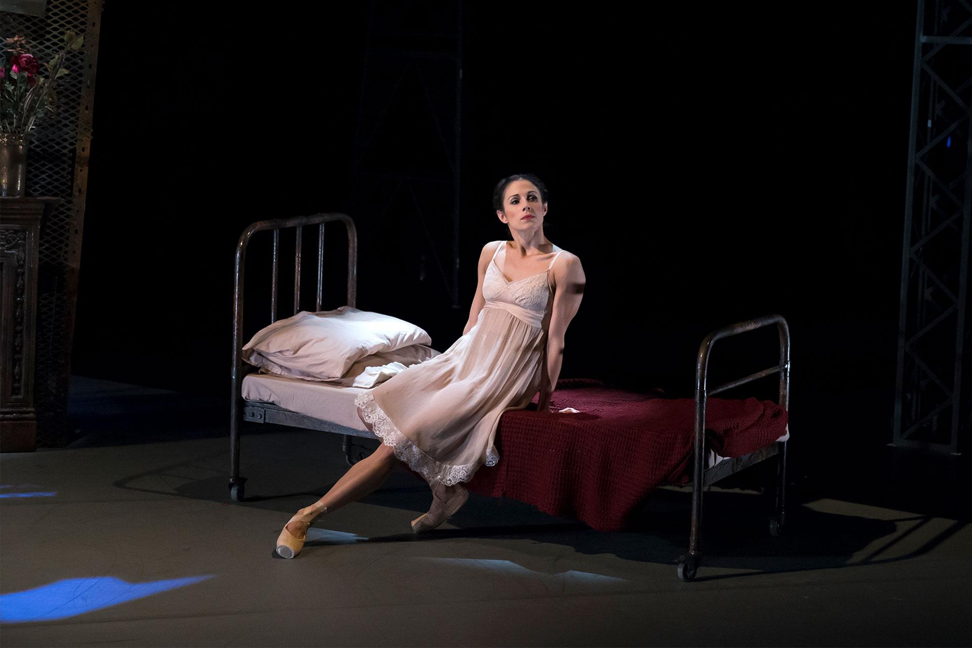 Julia waits on the bed in their unmonitored room waiting for Winston