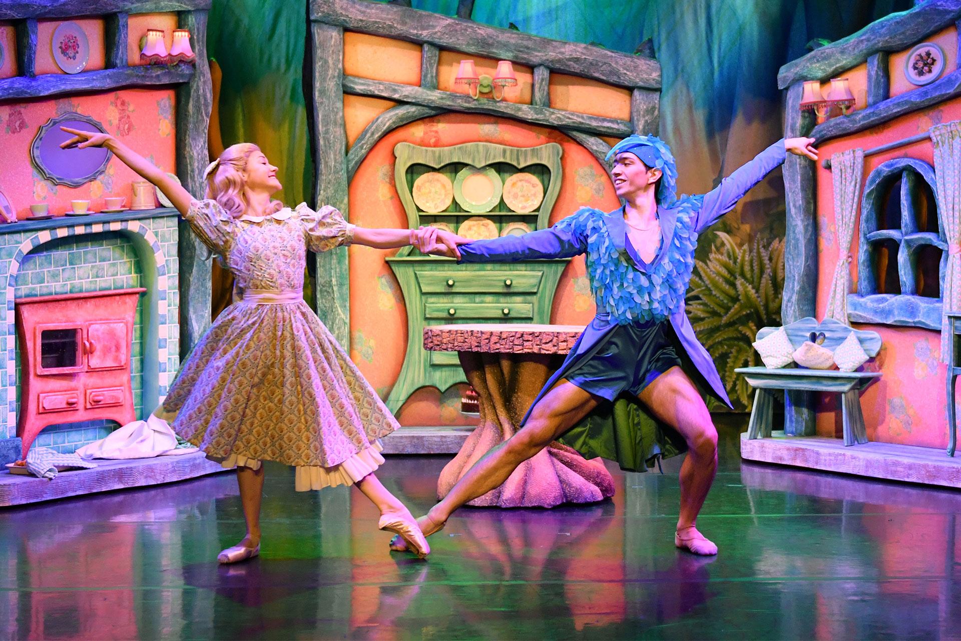 Goldilocks and Blue Bird dance together in the kitchen