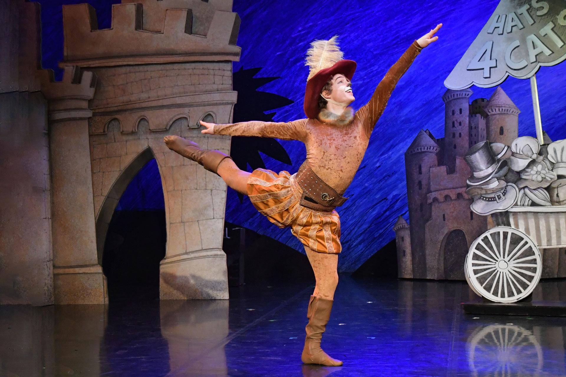 Puss dances the night away in his new clothes and fine hat