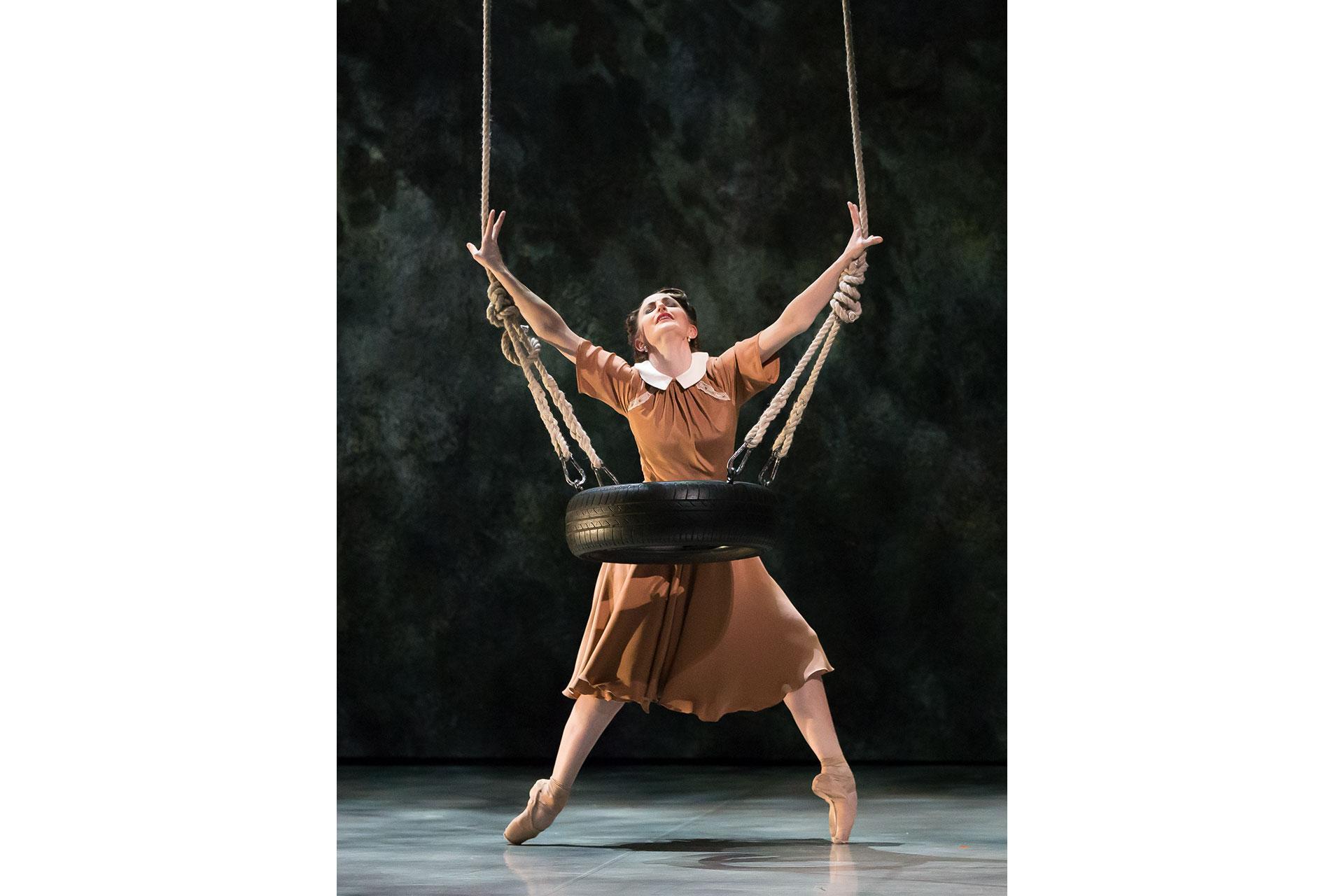 Bruno's mother dances at the tyre swing where her son plays