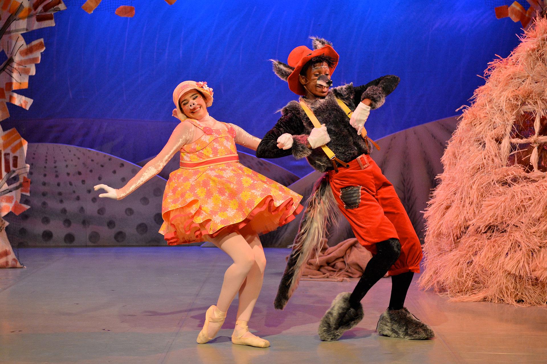 Straw Pig and Wolf dance happily together