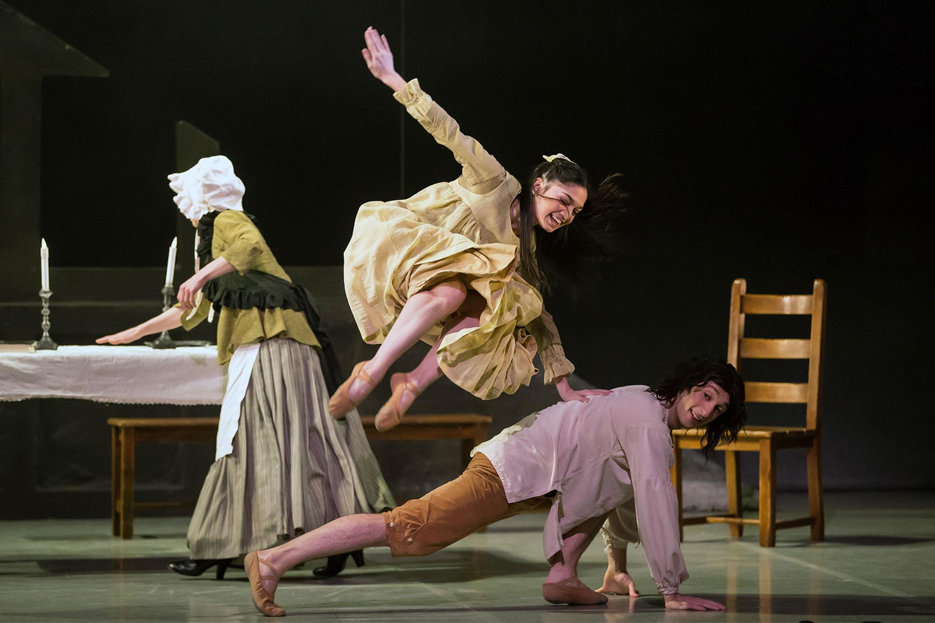Young Cathy plays in the kitchen with her adoptive brother