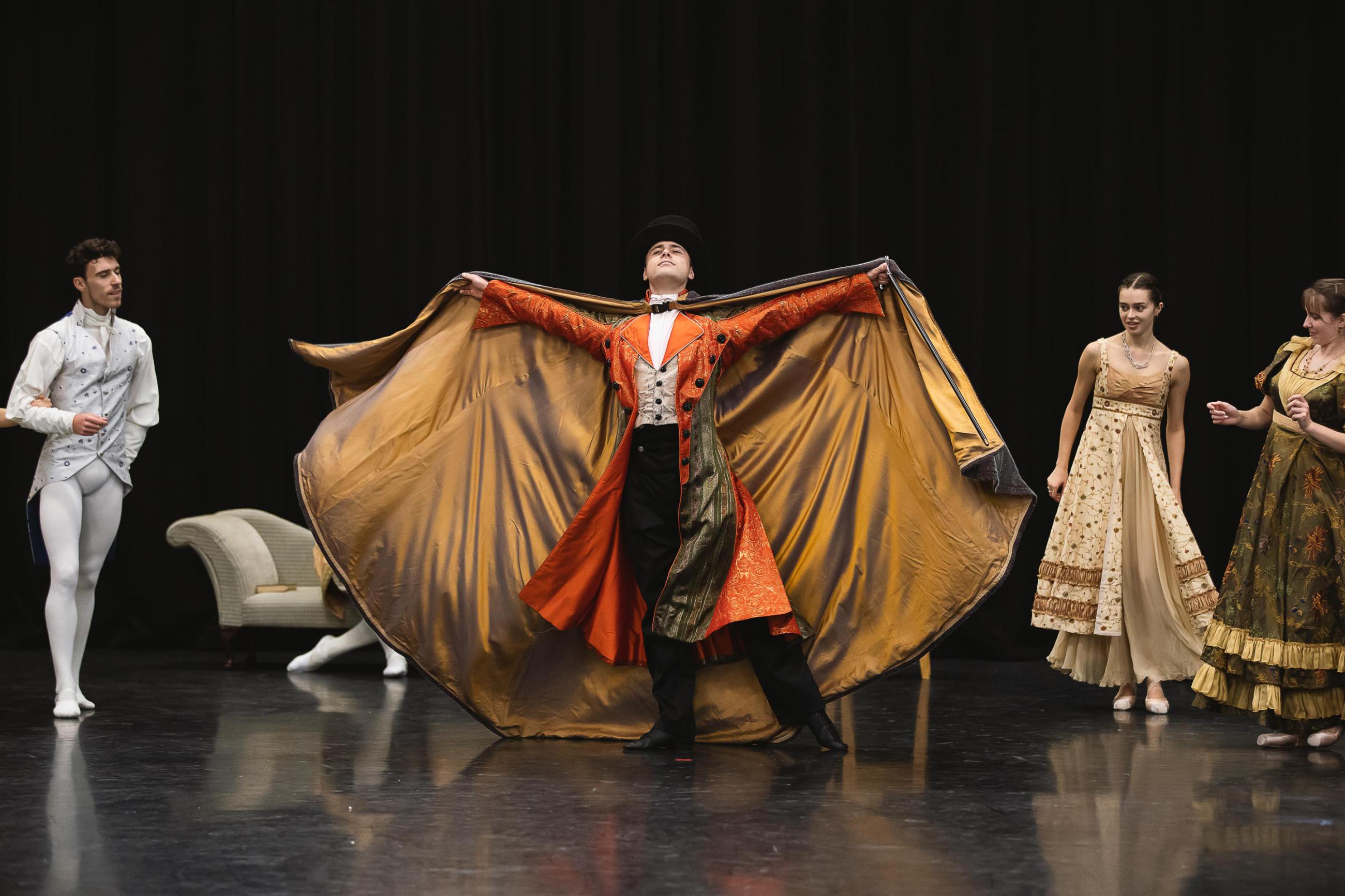 Dancer throwing his cloak back