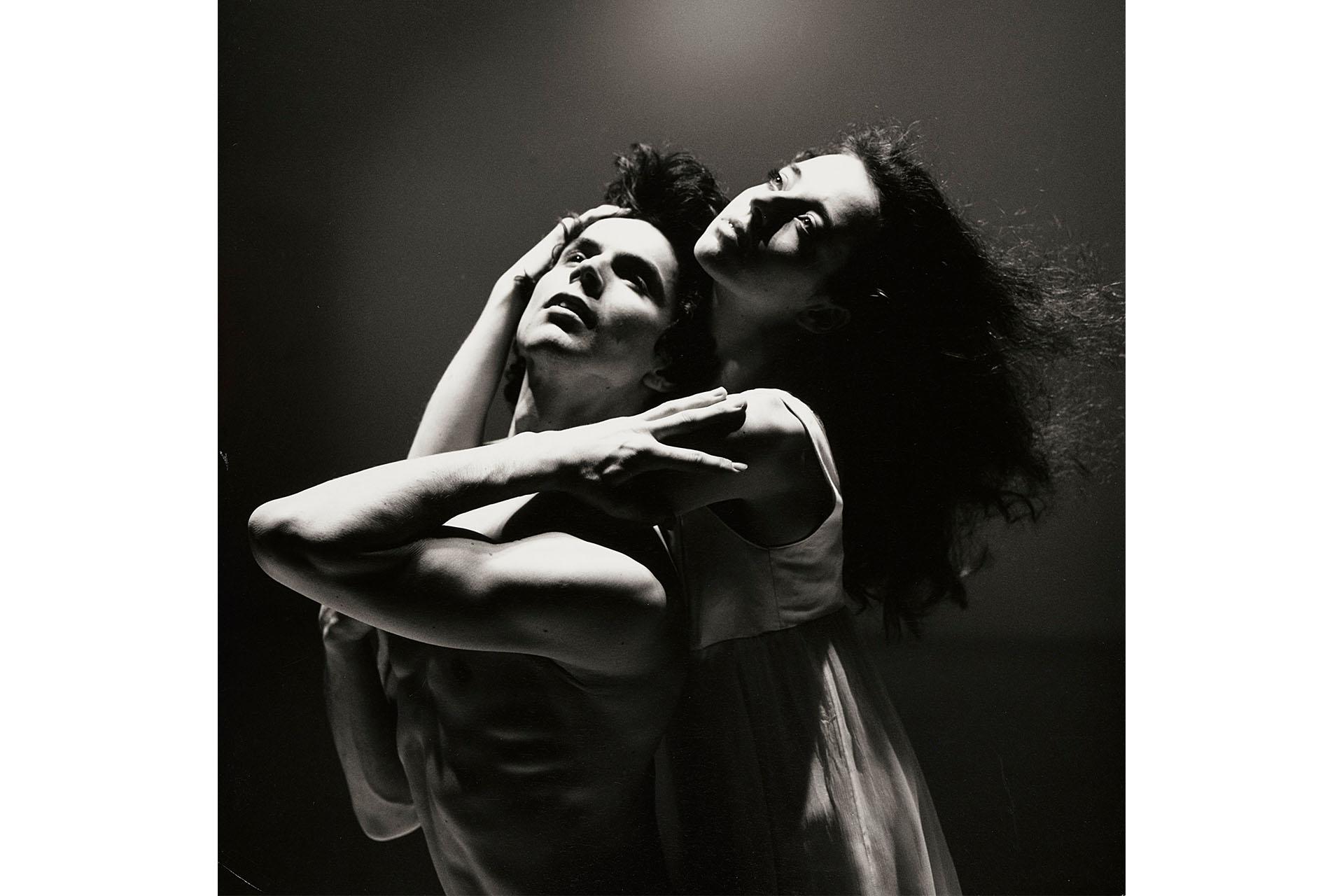 Dancers embracing each other in a black and white photo