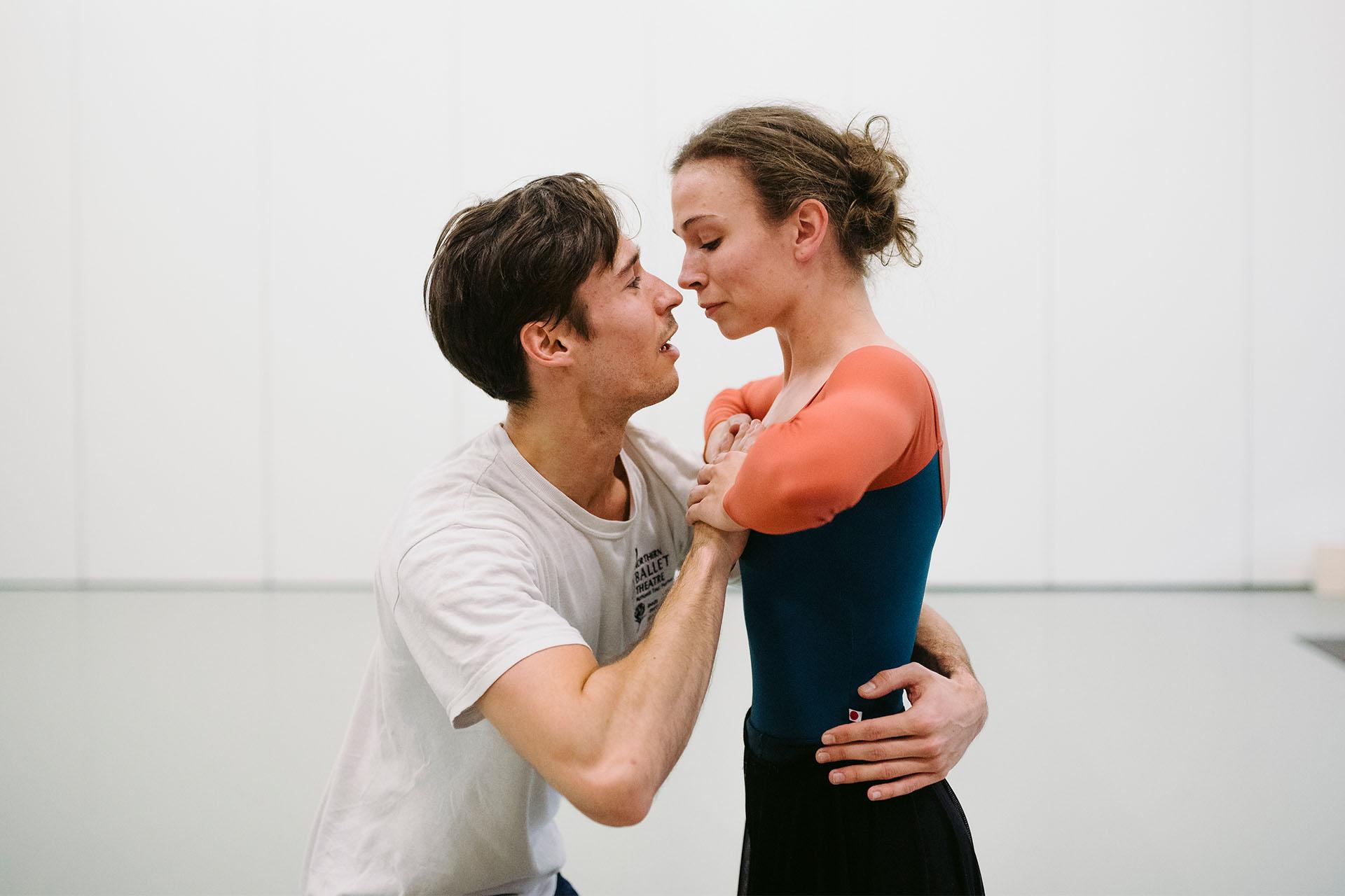 Two dancers in rehearsal look lovingly at each other as their roles of Prince Albert and Queen Victoria