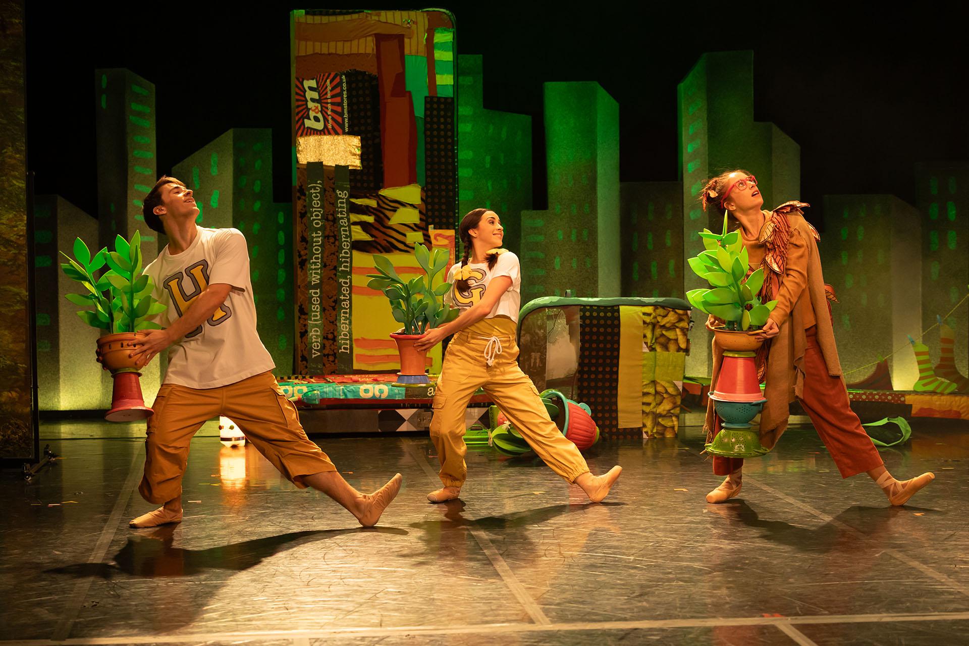 Hansel, Gretel and the Lady of the Forest look much happier as they dance with potted plants.