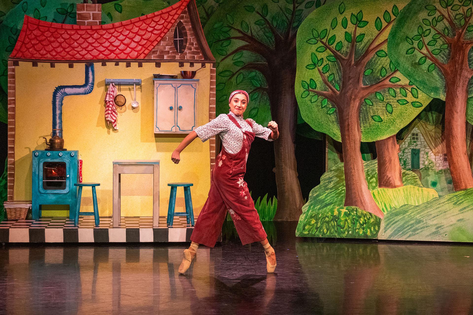 Little Red's mother strides across the stage en pointe and with purpose